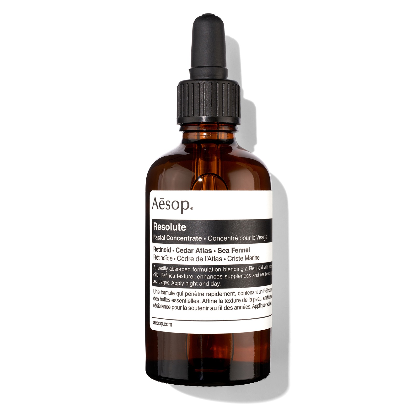 Amber glass dropper bottle with a black lid, featuring a white label with black text detailing the product name "Resolute" and ingredients like Cedar Atlas and Sea Fennel.