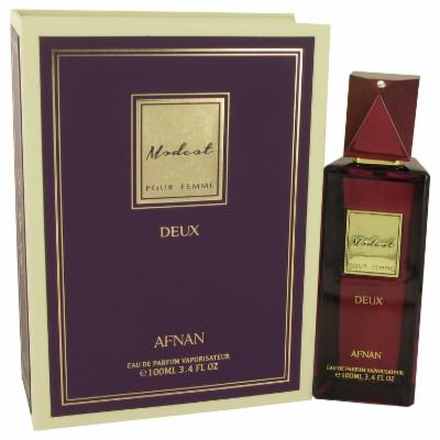 Elegant purple box with gold accents featuring "Modest Deux" label, alongside a glass perfume bottle with a deep red cap, containing 3.4 oz of women's eau de parfum.