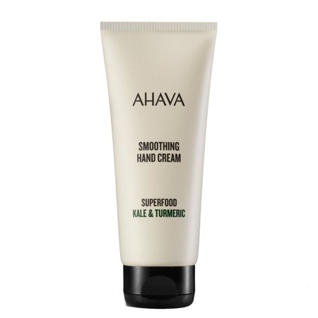 White tube of AHAVA Superfood Kale & Turmeric Smoothing Hand Cream, featuring a black cap and minimalist text design, 100ml size.