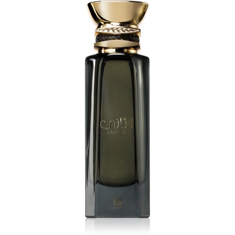 Elegant black glass bottle with a gold cap and intricate detailing, featuring the name "Laathani" in gold script, designed for unisex fragrance by Ahmed Al Maghribi.