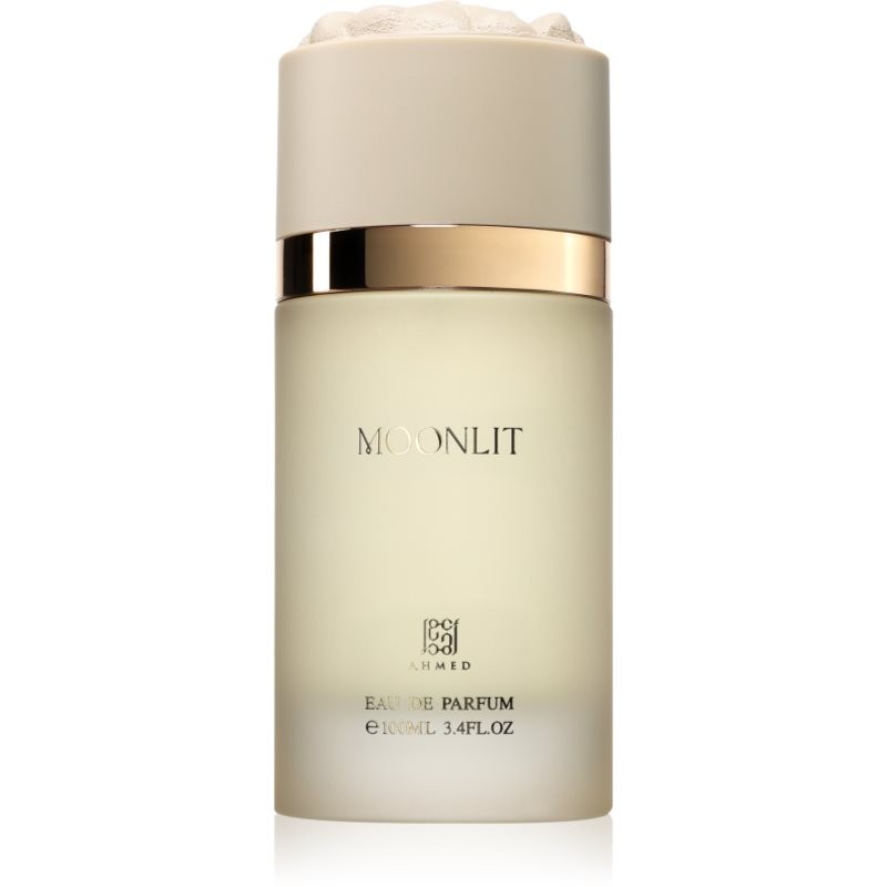 Clear glass bottle with a frosted finish, featuring a beige cap and gold accents, labeled "MOONLIT" and "EAU DE PARFUM" in elegant font, containing 100 ml of unisex fragrance.