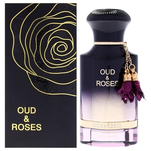 Elegant glass bottle of "Oud and Roses" perfume by Ahmed Al Maghribi, featuring a gradient purple to clear design, gold accents, and a decorative charm with purple tassels.