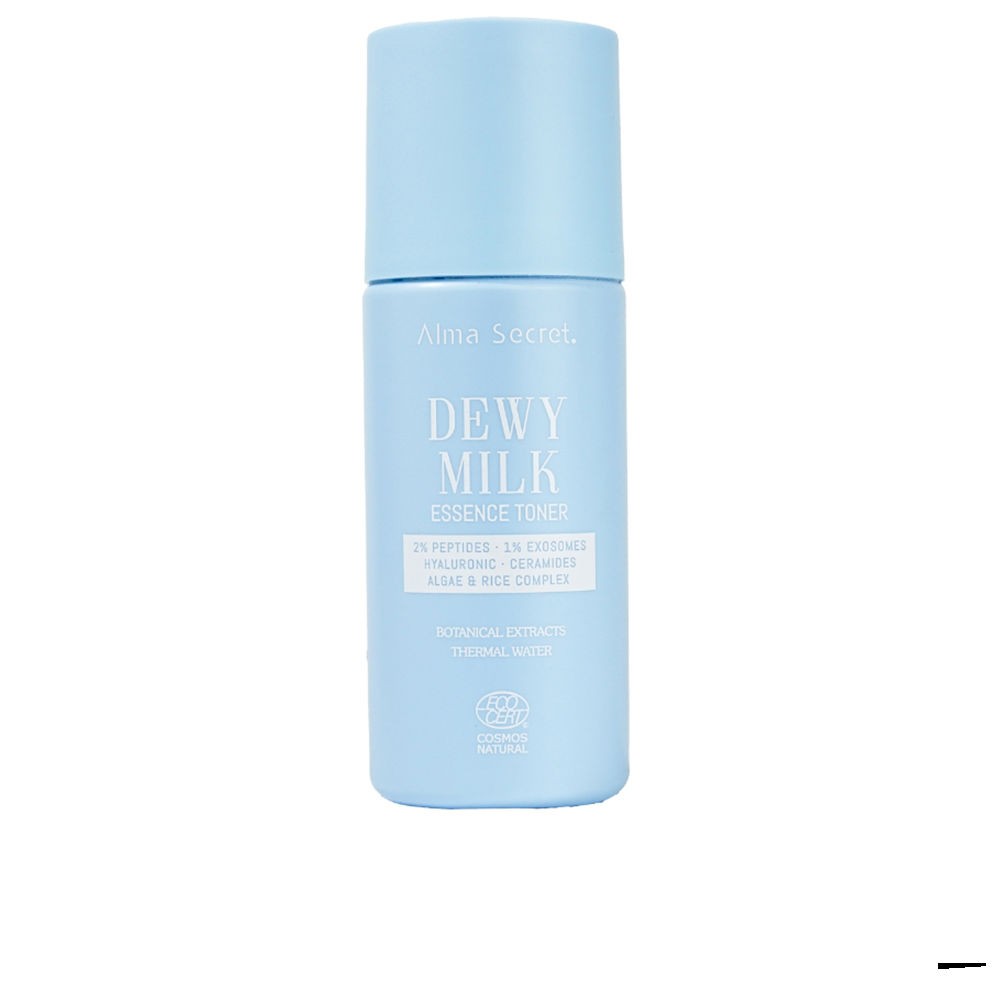 Light blue bottle of "Dewy Milk Tónico Esencial" by Alma Secret, featuring a sleek design, a twist cap, and labels highlighting key ingredients like peptides and hyaluronic acid.