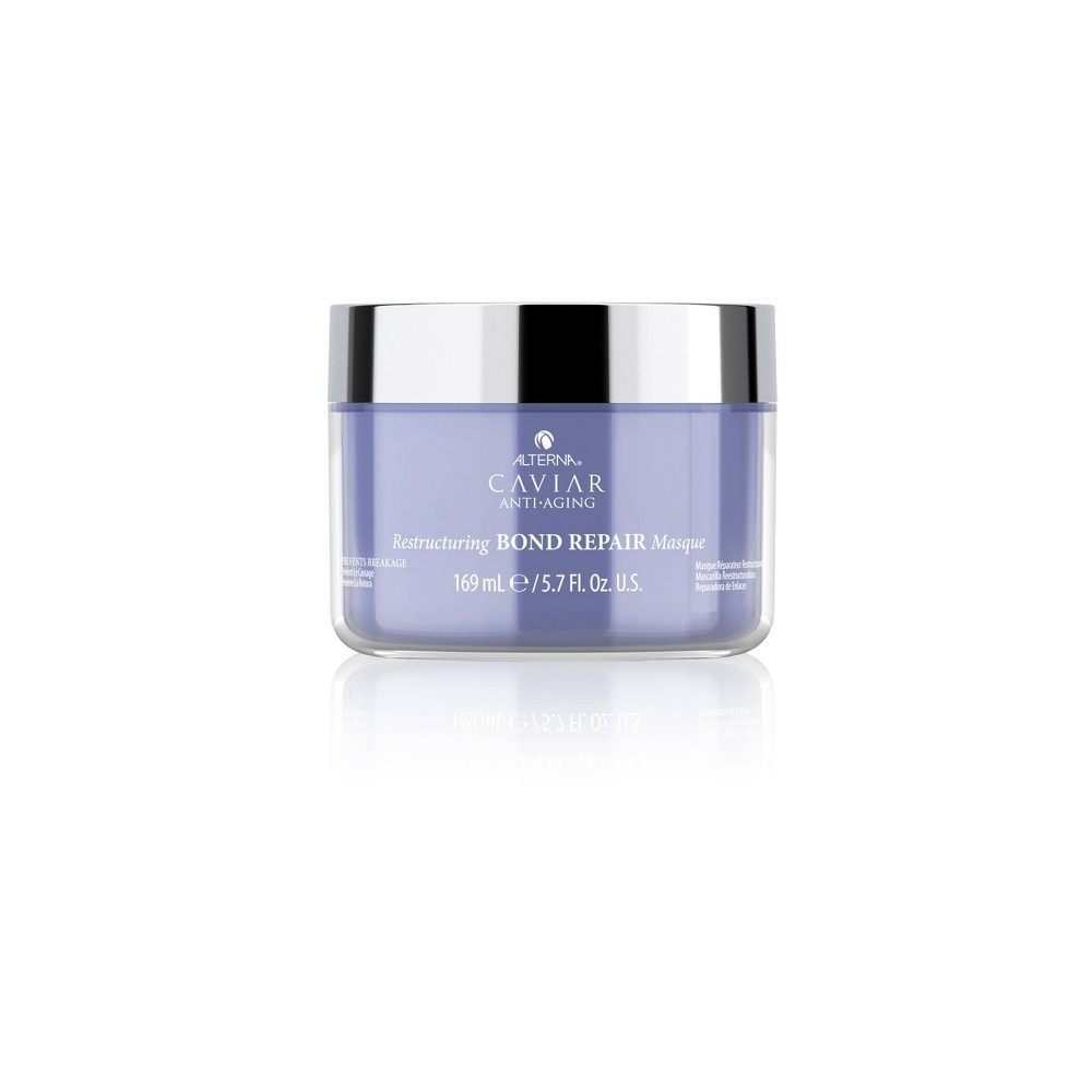 Lavender jar with a silver lid containing Alterna Caviar Anti-Aging Restructuring Bond Repair Masque, 5.7 oz, designed for hair restoration and hydration.
