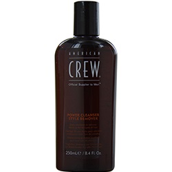 Brown plastic bottle of American Crew Power Cleanser Style Remover Shampoo for men, featuring a black cap and bold white lettering on the front.