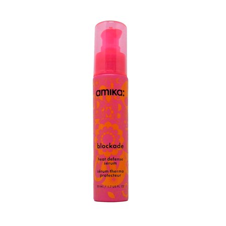Bright pink bottle with a pump dispenser, featuring a floral design and the label "blockade heat defense serum" in bold black text, 1.7 oz size for unisex use.