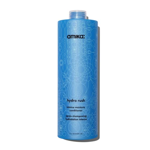 Tall, cylindrical blue bottle with a floral design, featuring black text that reads "Amika Hydro Rush Intense Moisture Conditioner" in a sleek, modern font.