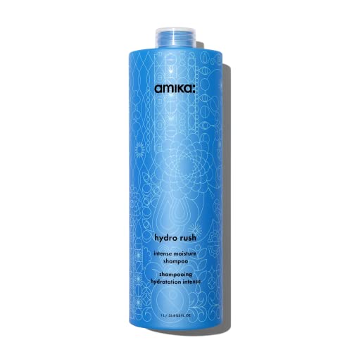 Bright blue bottle of Amika Hydro Rush Intense Shampoo, featuring intricate white floral designs, with a flip-top cap and labeled for intense moisture and hydration.