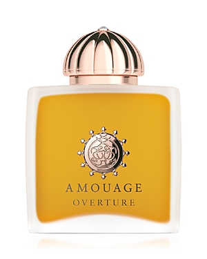 Clear glass bottle with a gold and rose gold cap, featuring a circular emblem and the label "Amouage Overture" in elegant font, containing a golden yellow perfume.