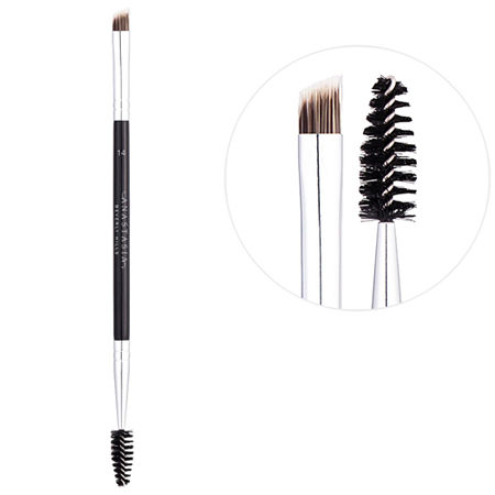 Dual-ended firm detail brush with a flat angled brush on one end and a spoolie on the other, featuring a sleek silver ferrule and a black handle with the brand name.
