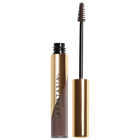 Dipbrow Gel in Caramel features a sleek gold tube with a black wand and a spiral brush, designed for precise eyebrow application and shaping.