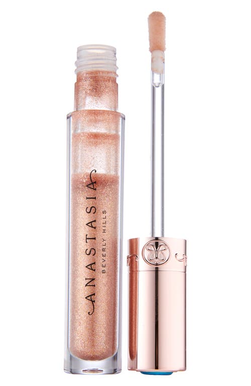 Translucent lip gloss in a clear tube with a gold shimmer, featuring a doe-foot applicator and a rose gold cap, labeled "Anastasia Beverly Hills" in elegant script.
