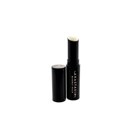 White lip primer stick in a sleek black tube with a silver logo, featuring a twist-up mechanism for easy application.