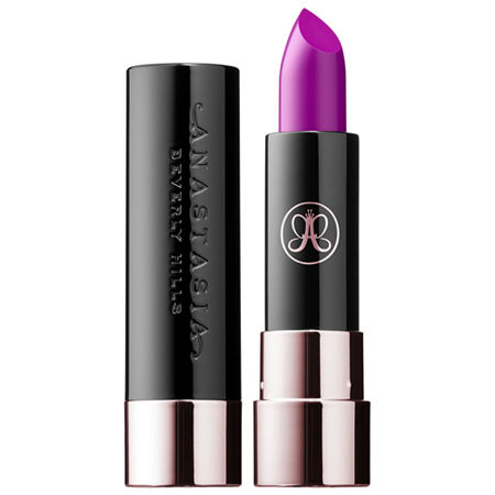 Matte lipstick in a sleek black tube with a rose gold base, featuring a vibrant purple shade called "Rage" and the Anastasia Beverly Hills logo on the cap.