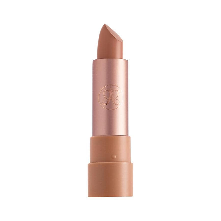 Satin lipstick in a creamy butterscotch shade, housed in a sleek rose gold tube with the Anastasia Beverly Hills logo embossed on the side.