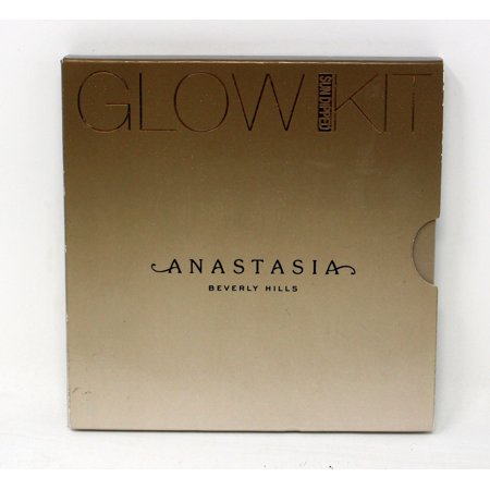 Gold-toned compact featuring "GLOW KIT" embossed on the front, with "ANASTASIA BEVERLY HILLS" elegantly printed below, designed for highlighting and illuminating the skin.