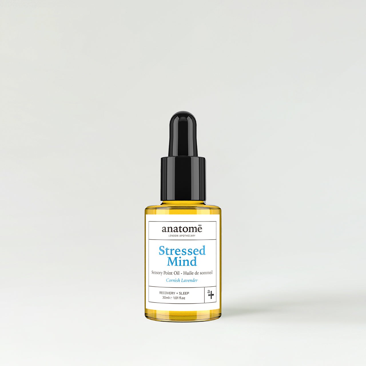 30ml glass bottle of Anatomē Restless Mind Sleep Oil with a black dropper lid, featuring a white label with blue text, highlighting Roman Chamomile as a key ingredient.