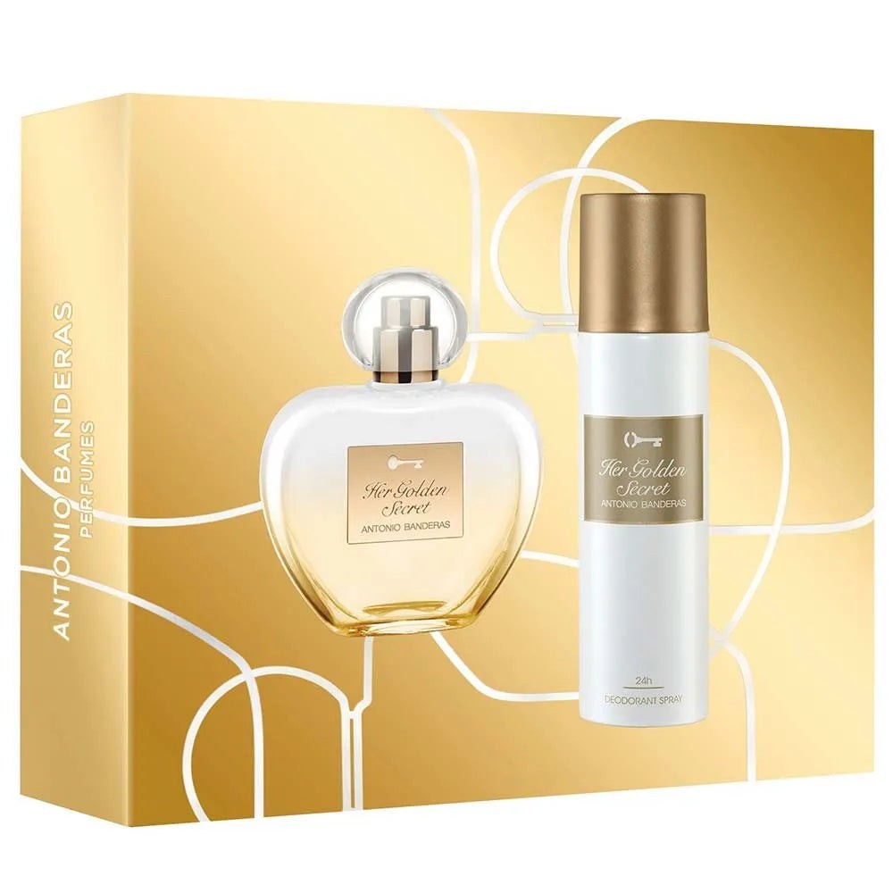 Golden gift box featuring an elegant glass bottle of Her Golden Secret Eau de Toilette and a matching deodorant spray, both adorned with Antonio Banderas branding.