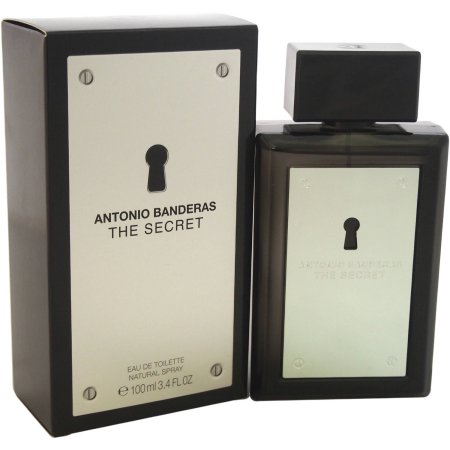 Black rectangular bottle with a square cap, featuring a silver label with a keyhole design, alongside a matching box, both labeled "The Secret by Antonio Banderas."