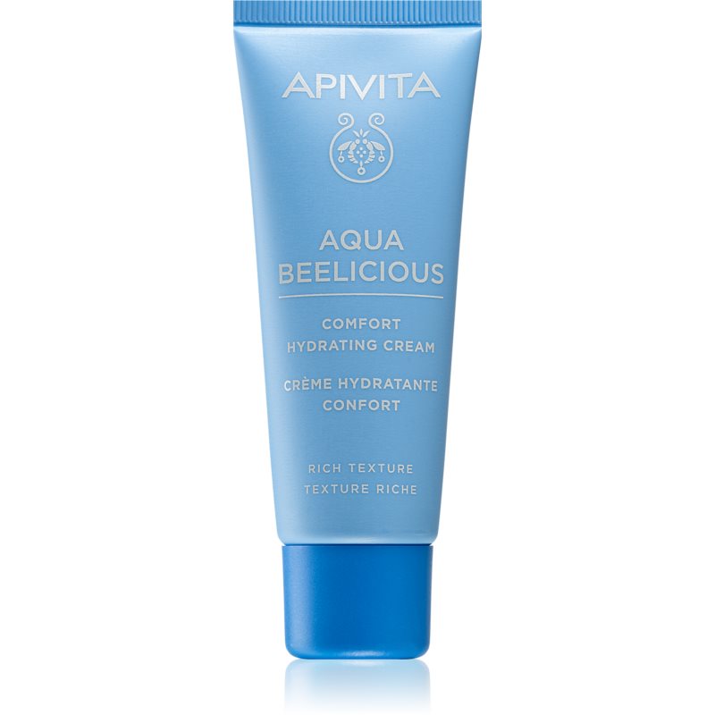Light blue tube of Apivita Comfort Hydrating Rich Cream with a blue cap, featuring white text and a decorative logo, emphasizing rich texture and hydration benefits.
