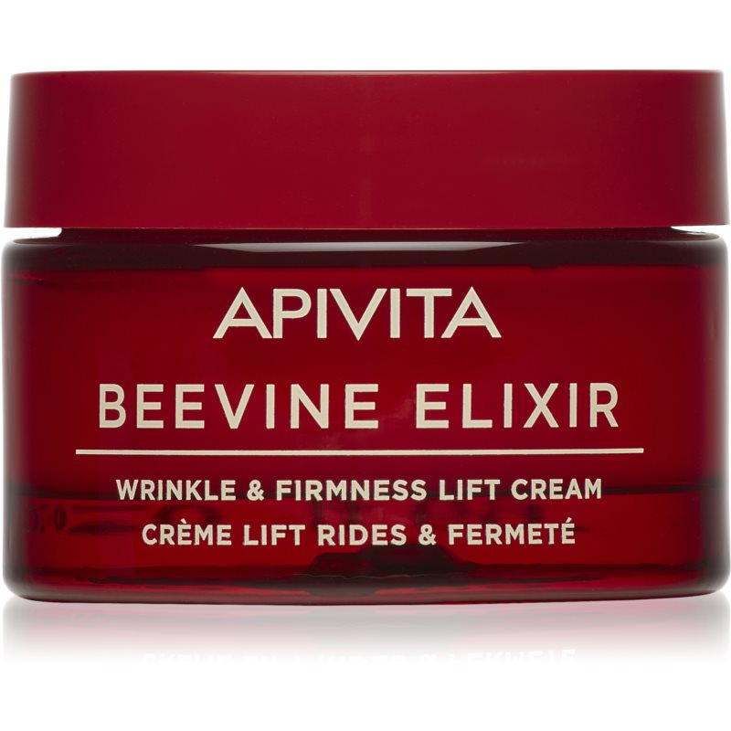 Deep red glass jar with a glossy red lid, labeled "APIVITA BEEVINE ELIXIR" in white text, containing 50ml of wrinkle and firmness lift cream.