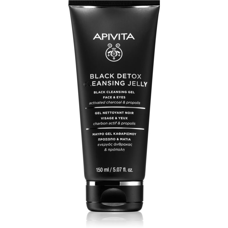 Black tube with a matte finish featuring white text, labeled "Apivita Black Detox Cleansing Jelly for Face & Eyes," containing 150ml of activated charcoal and propolis.