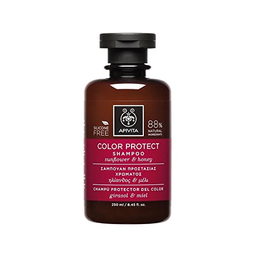 Brown glass bottle with a black pump cap, featuring a maroon label that reads "Color Protect Shampoo" with sunflower and honey graphics, 8.45 oz, silicone-free, 88% natural ingredients.