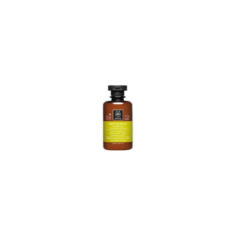 Brown glass bottle with a black cap, featuring a green label that reads "Gentle Daily Shampoo with Chamomile & Honey" by APIVITA, highlighting natural ingredients.