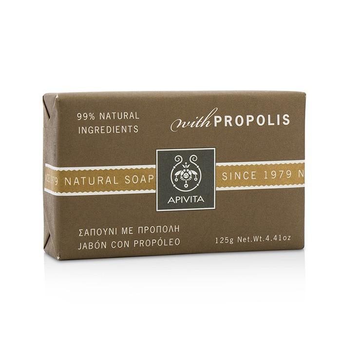 Brown rectangular soap bar packaging with a minimalist design, featuring the APIVITA logo, "Natural Soap" text, and "with Propolis" label, indicating 99% natural ingredients.