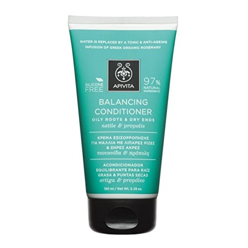 Green and white tube of Apivita Balancing Balm for Oily Roots and Dry Ends, featuring nettle and propolis, with a 150ml capacity and a silicone-free label.