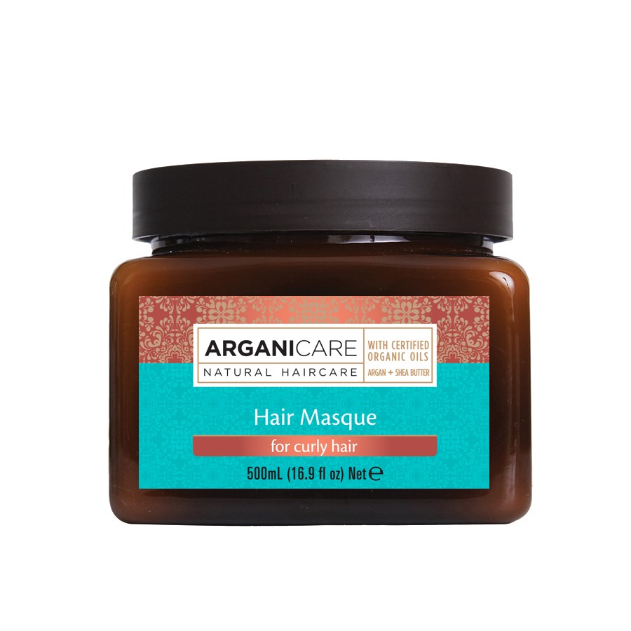 Brown jar with a dark lid, featuring a turquoise label that reads "ARGANICARE Hair Masque for Curly Hair" with details about volume (500ml) and natural ingredients.