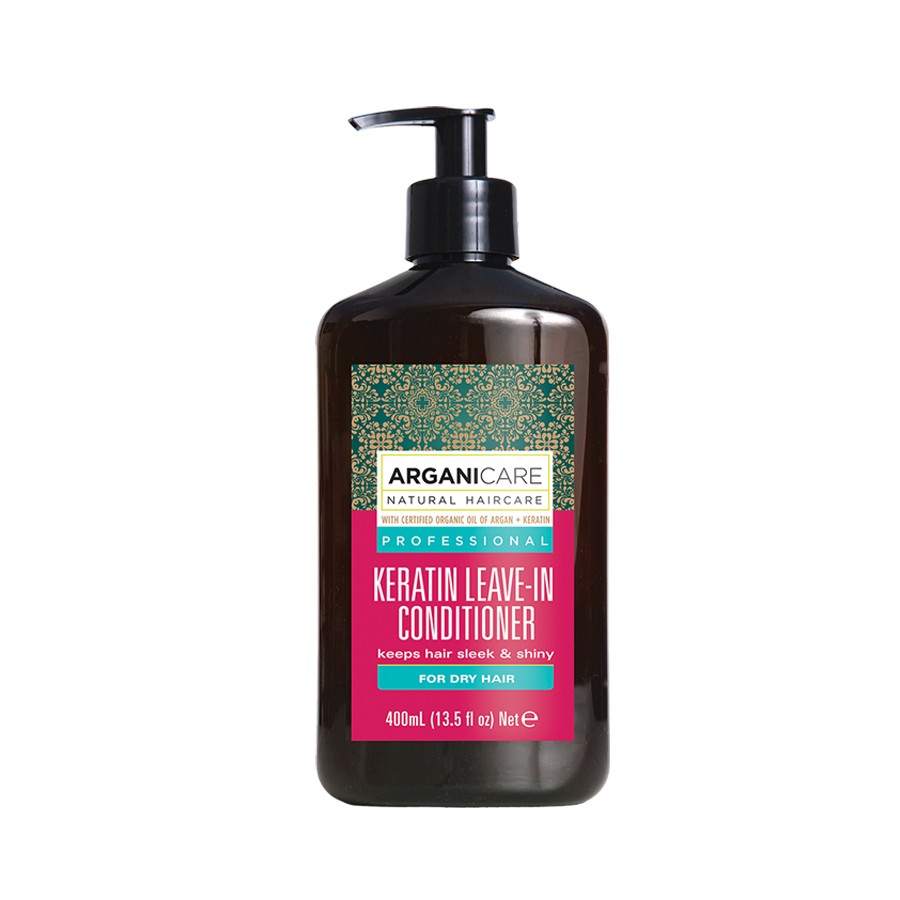 Brown plastic bottle with a black pump dispenser, featuring a green and gold patterned label and a pink section that reads "Keratin Leave-In Conditioner for Dry Hair," 400 ml.