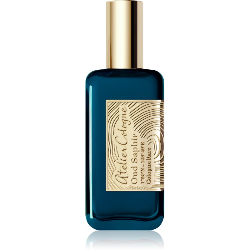 A deep blue glass bottle with a gold cap, featuring an ornate gold label that reads "Atelier Cologne Oud Saphir Cologne Rare" in elegant lettering.