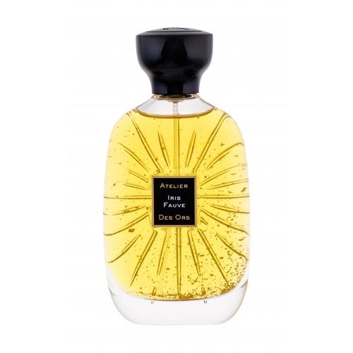 Clear glass bottle with a sunburst design, filled with golden yellow perfume, topped with a black cap and featuring a black label that reads "Atelier Iris Fauve Des Ors."