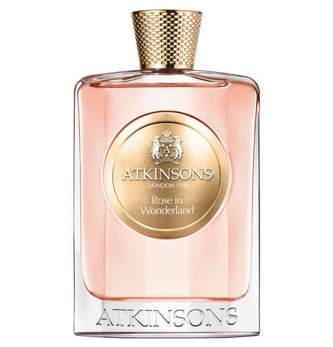 Clear glass bottle with a gold cap, featuring a round gold label that reads "ATKINSONS Rose in Wonderland" and a pink liquid inside, elegantly designed for a luxurious look.