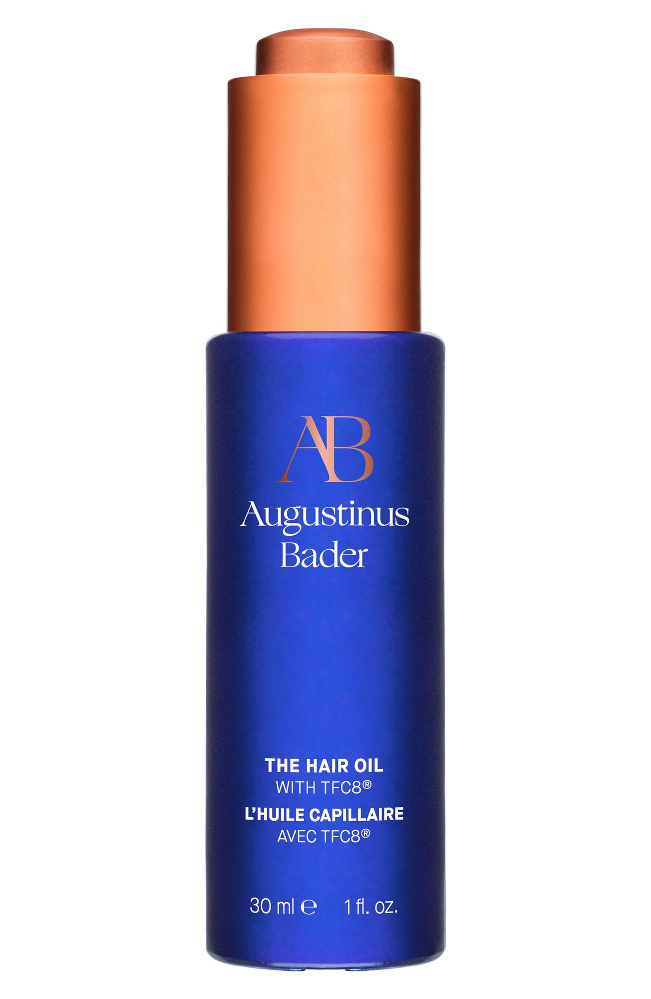 Blue glass bottle with a copper cap, labeled "Augustinus Bader The Hair Oil with TFC8," featuring a sleek design and 30 ml capacity.
