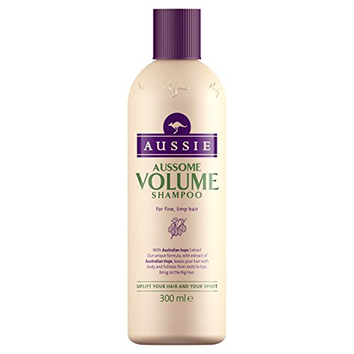 Light beige bottle of Aussie Aussome Volume Shampoo, 300ml, featuring a purple label with the brand name and product details, designed for fine, limp hair.