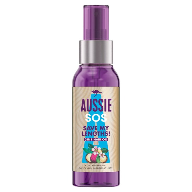 Purple spray bottle with a clear cap, labeled "Aussie SOS Save My Lengths! 3in1 Hair Oil," featuring illustrations of avocado and macadamia nuts.