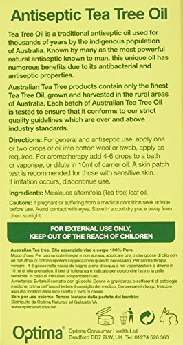 Green and yellow packaging for Australian Tea Tree Essential Oil, featuring a 10ml bottle with a dropper, labeled as antiseptic with usage instructions and safety warnings.