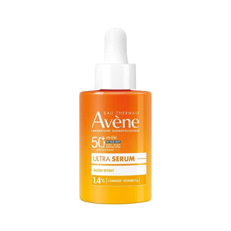 Bright orange serum bottle with a dropper, labeled "Avène 50+ ULTRA SERUM 1,4% COMPLEX VITAMIN," featuring a white cap and a sleek design, emphasizing its glow-enhancing properties.