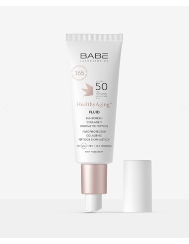 HealthyAging+ Fluid SPF50 by Babé in a white tube with a pink accent, featuring a pump dispenser and labeled with sun protection and anti-pollution benefits.