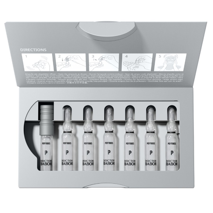 Seven glass ampoules in a sleek gray box, labeled "Doctor Babor Sensitive," with clear serum visible; includes usage directions printed inside the lid.