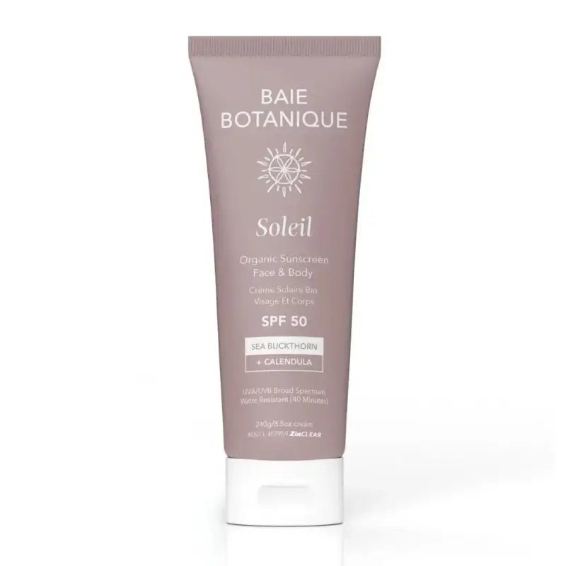 Light beige tube of Baie Botanique Soleil Face & Body Sunscreen SPF 50, featuring a sun graphic, with key ingredients listed as sea buckthorn and calendula.