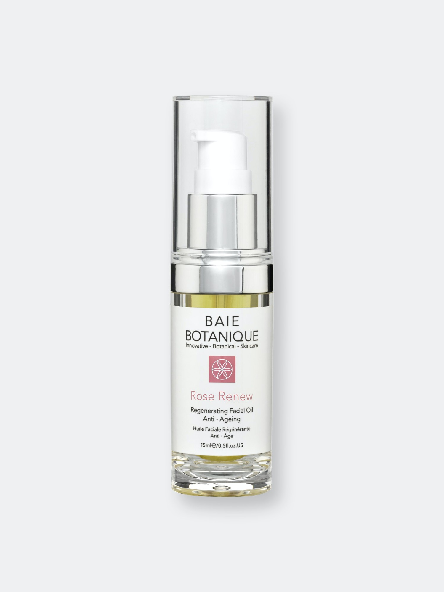 Clear glass bottle with a silver pump top, labeled "Baie Botanique Rose Renew Facial Oil" in elegant font, featuring a pink and white design, 15ml size, showcasing a light golden oil inside.