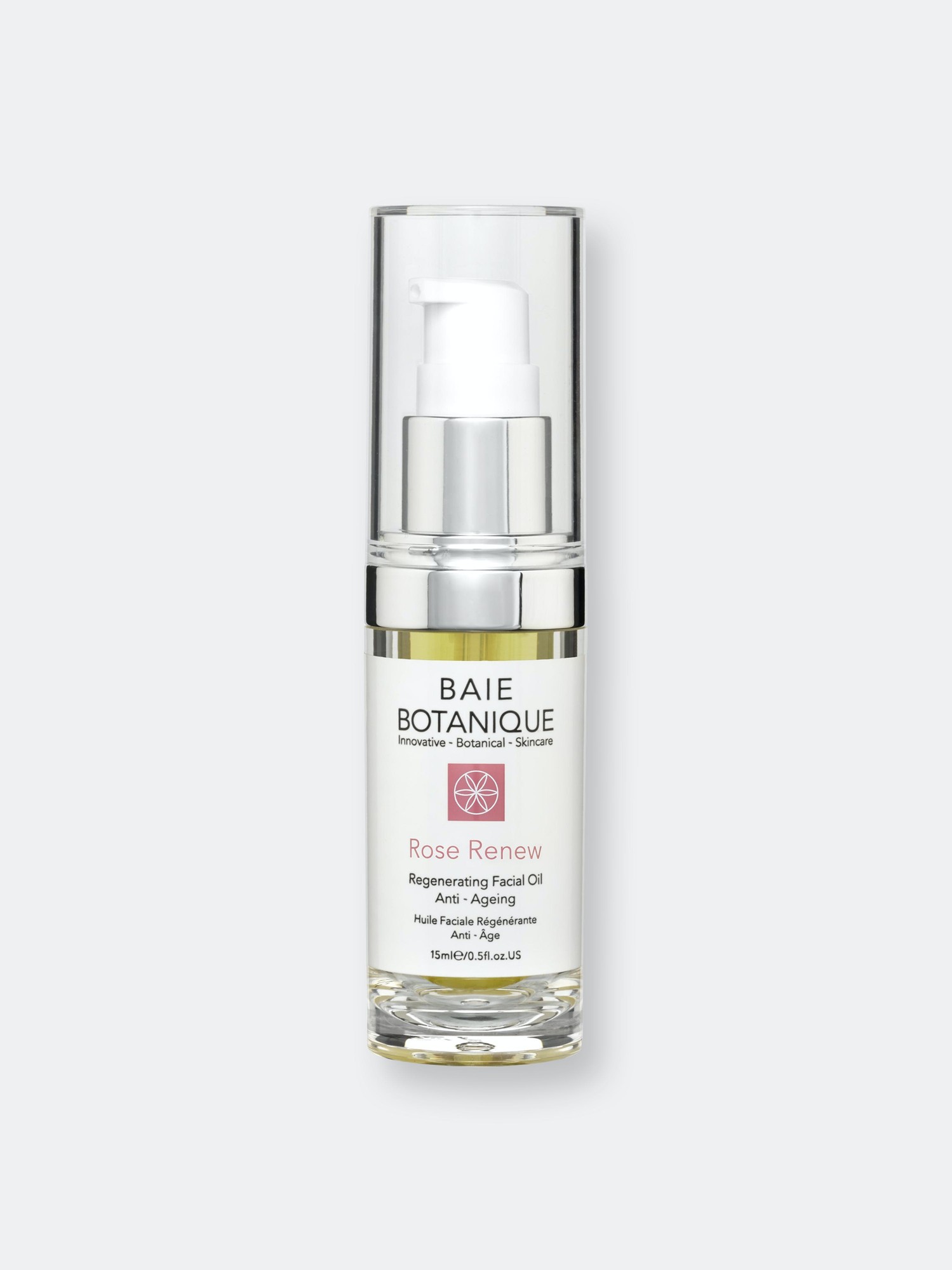 Clear glass bottle with a silver pump, featuring a white label with pink accents, labeled "Baie Botanique Rose Renew Facial Oil - 30ml," emphasizing anti-aging properties.