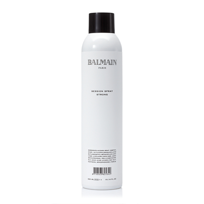 White cylindrical spray can with a black cap, labeled "BALMAIN PARIS SESSION SPRAY STRONG," featuring minimalist black text on the front.