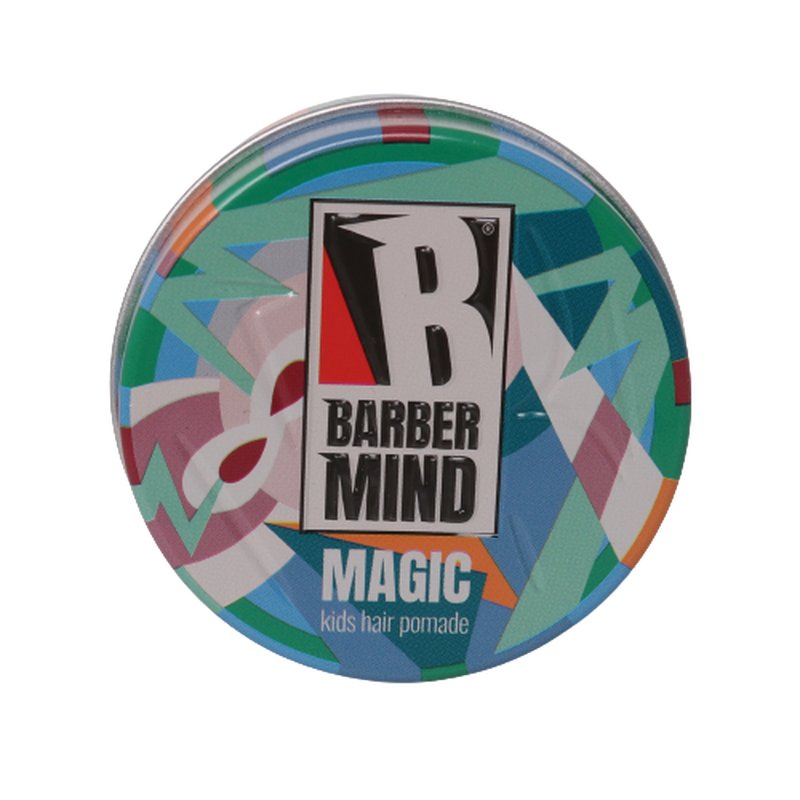 Round tin container of Barber Mind Magic Kids Pomade, featuring a colorful geometric design with shades of green, blue, pink, and yellow, and a prominent black and white logo.