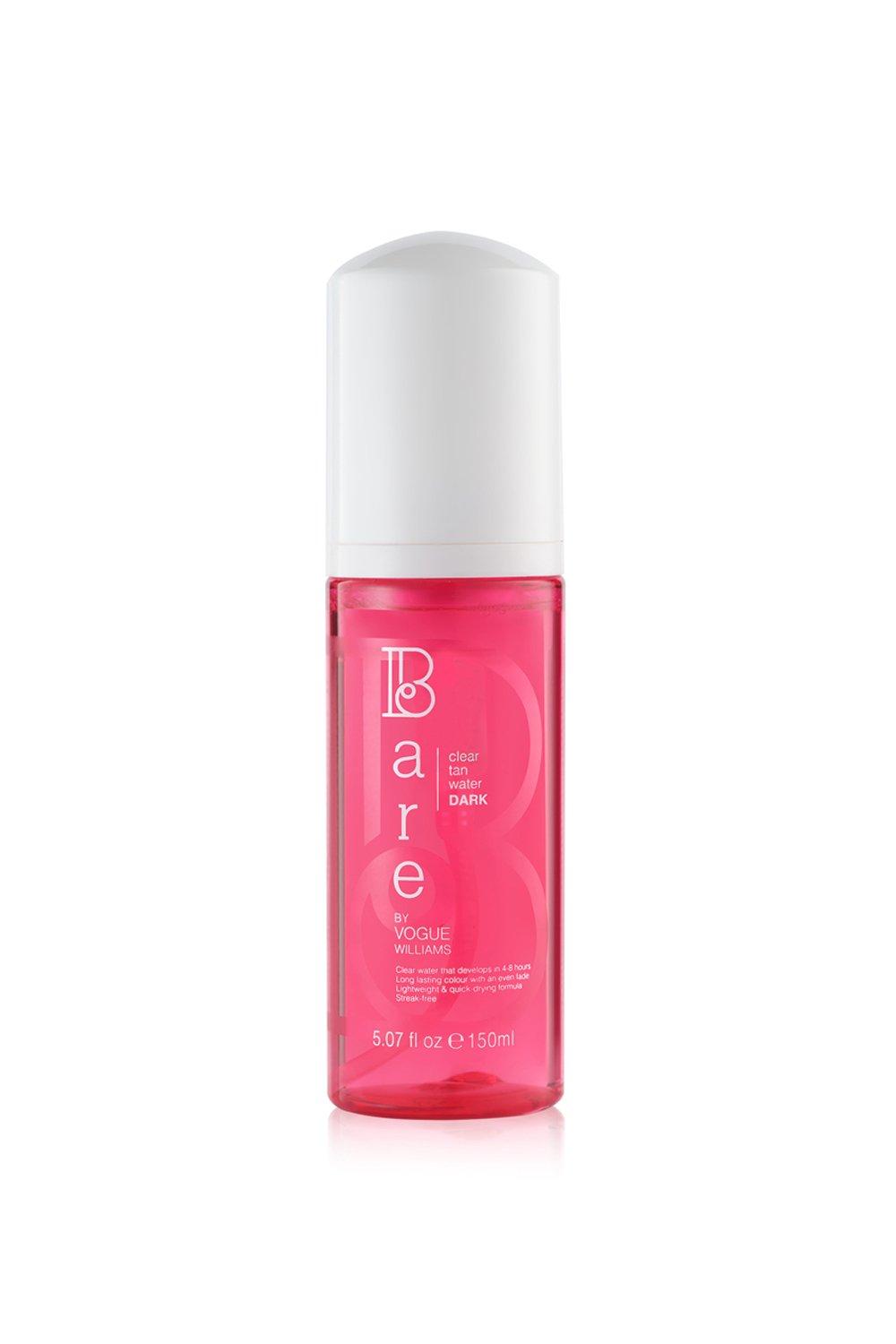 Clear tan water in a 150ml pink bottle with a white cap, labeled "Bare by Vogue" and marked "DARK" for unisex use.