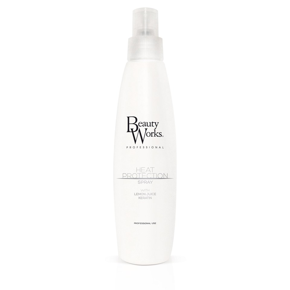 White spray bottle with a sleek design, featuring a black logo that reads "Beauty Works Professional" and the text "Heat Protection Spray" in a minimalist font.