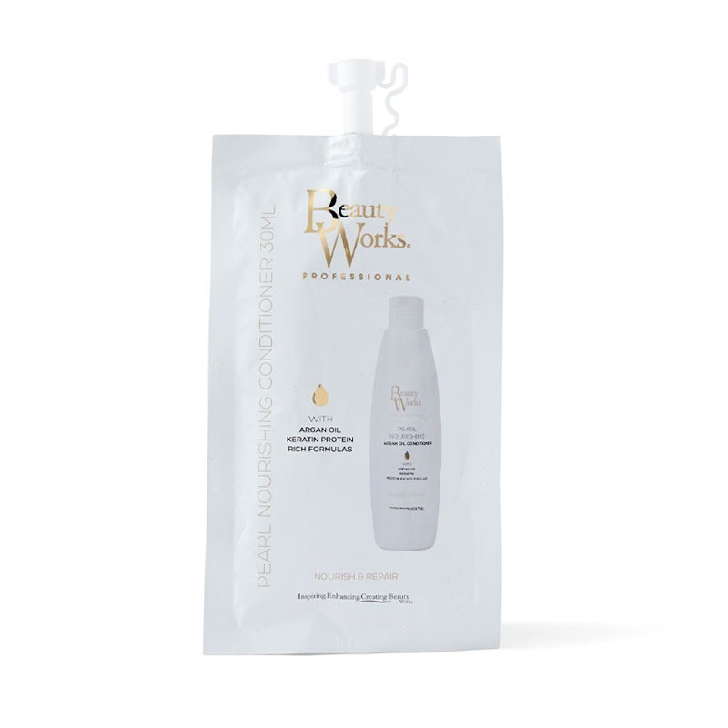 White pouch featuring "Beauty Works" branding in gold, containing 30ml of Pearl Nourishing Conditioner, highlighting key ingredients like argan oil and keratin protein.